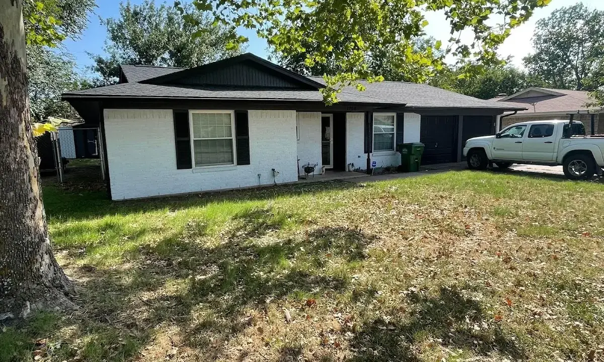 Professional roofing crew working on a residential roof in Bernardsville